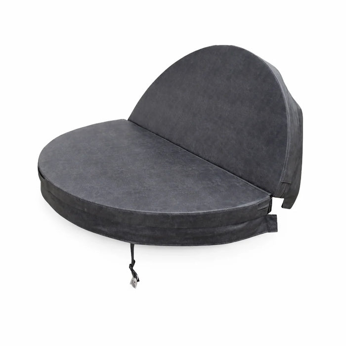 Charcoal grey circular spa pool cover shown partially folded open, highlighting the insulated tapered design and centre hinge.