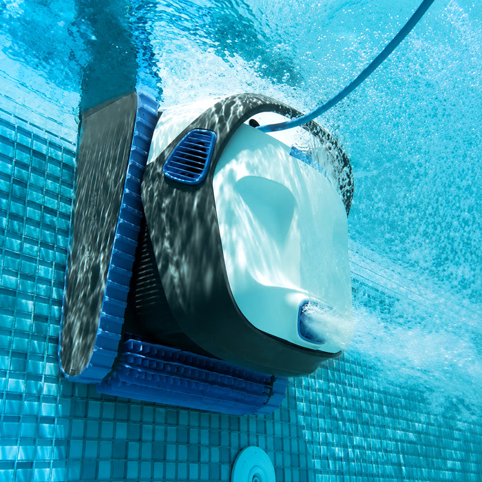 Robotic pool cleaner in action on a tiled pool floor