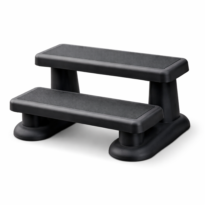 Black two-step spa steps with slip-resistant treads on a white background