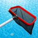 Red swimming pool leaf scoop with black mesh net and silver telescopic pole over blue pool water
