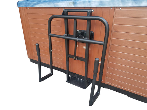 A black undermount cradle style spa pool cover lifter installed beside a wooden spa pool.