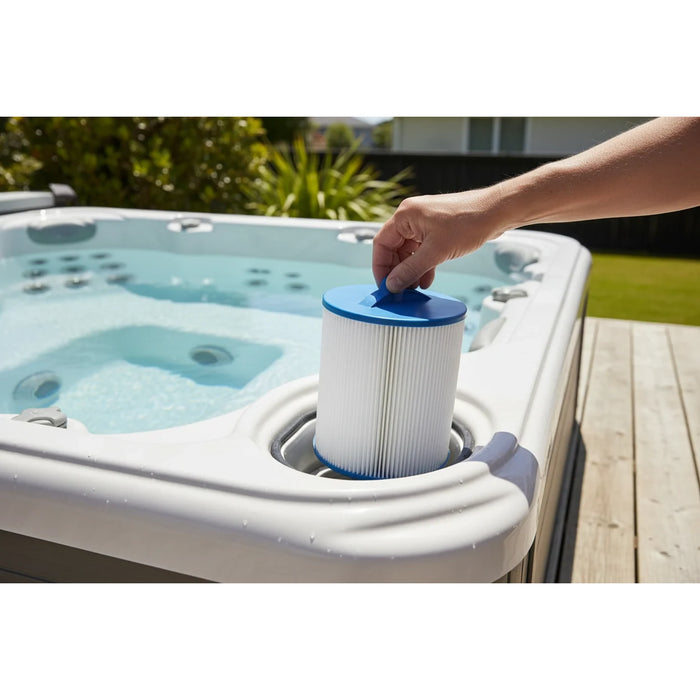 Alpine C18 spa filter being lowered into a spa filter housing