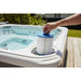 Alpine C18 spa filter being lowered into a spa filter housing