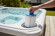 Alpine C18 spa filter being lowered into a spa filter housing