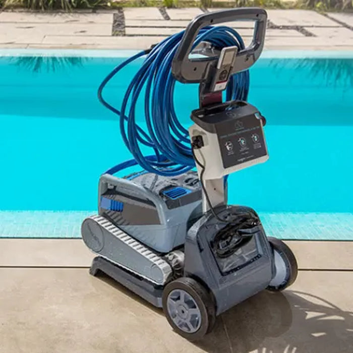 Dolphin M700 robotic pool cleaner and caddy viewed from the rear beside a swimming pool