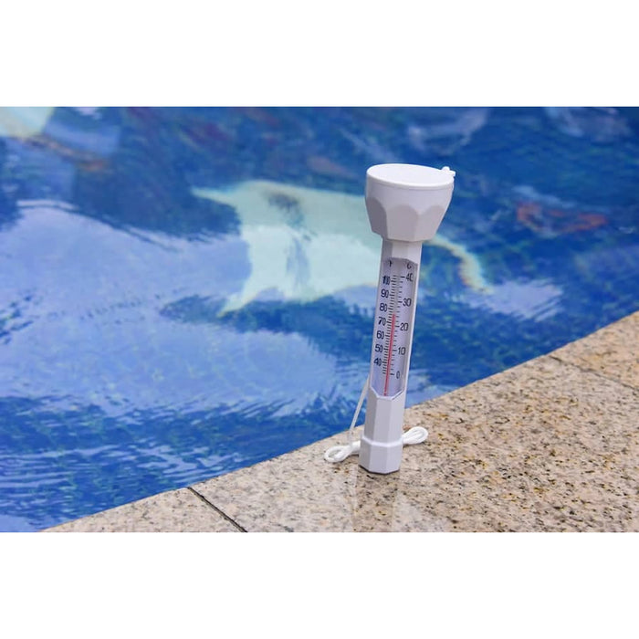 Jumbo pool thermometer standing upright on the pool edge