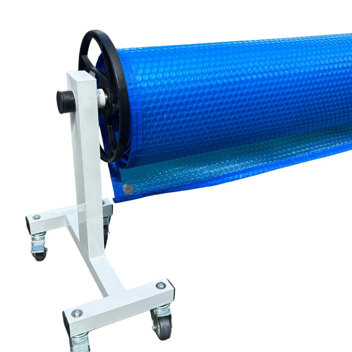 Blue solar pool cover wound onto a roller with wheeled support stand
