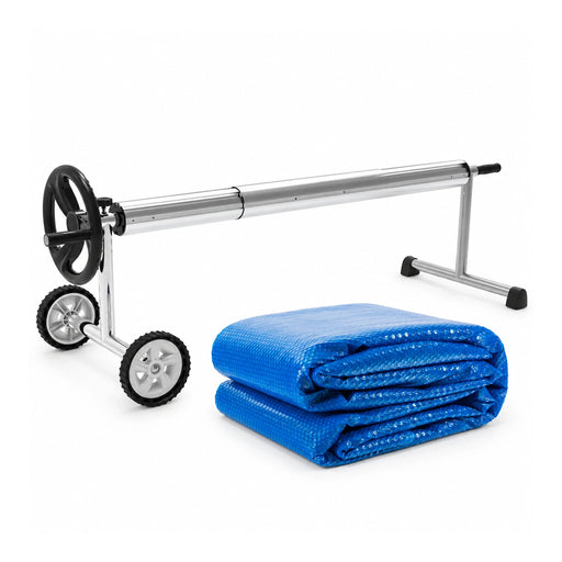 Blue solar bubble pool cover folded beside its aluminium manual roller for the 10m x 5m bundle.
