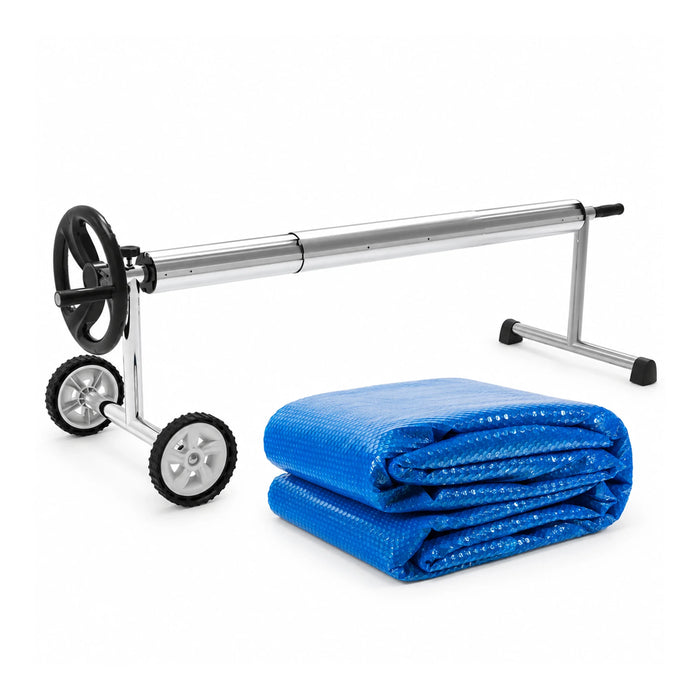 Blue solar bubble pool cover folded beside its aluminium manual roller for the 10m x 5m bundle.