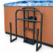 Black undermount cradle cover lifter installed beside a spa