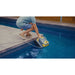 Zodiac CX-series robotic pool cleaner being lifted from a swimming pool