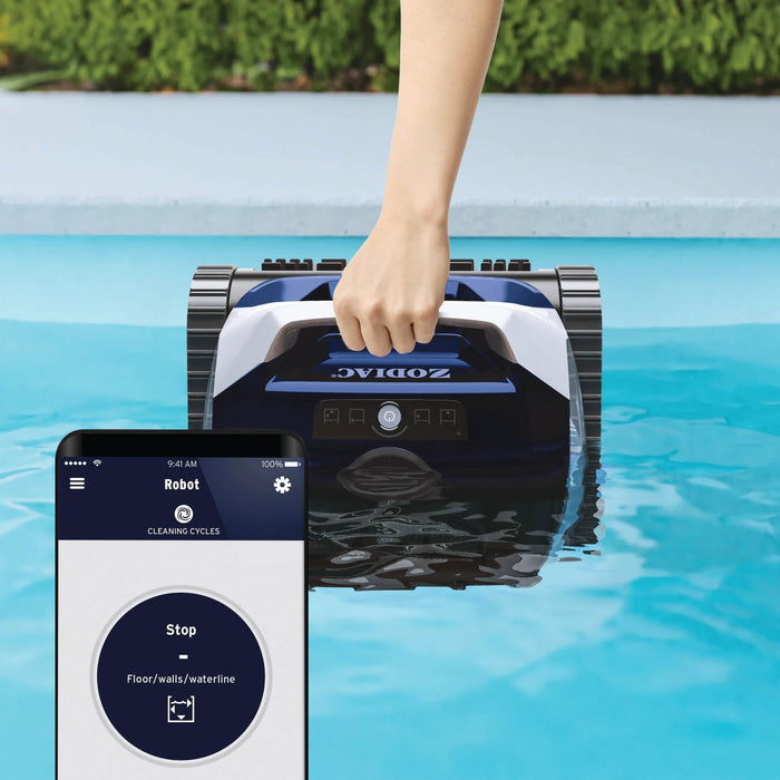 Zodiac FR350 iQ being lifted from the waterline beside a Fluidra Pool app screen